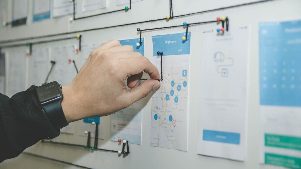Designer and developer collaborating at a whiteboard